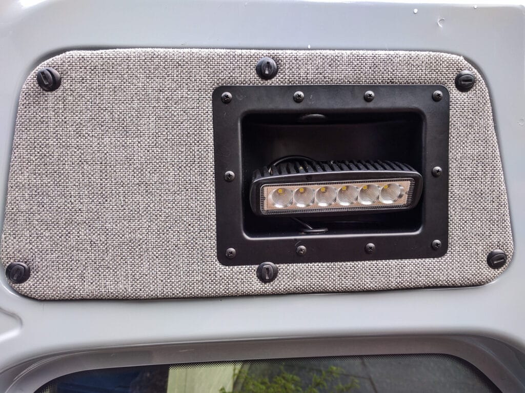 Lights mounted in repurposed amp case handles in rear doors