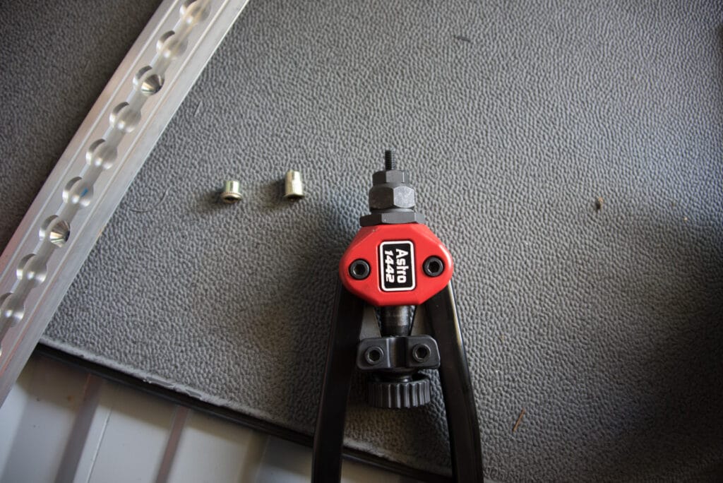 compressed (left) and uncompressed rivnuts and the setting tool