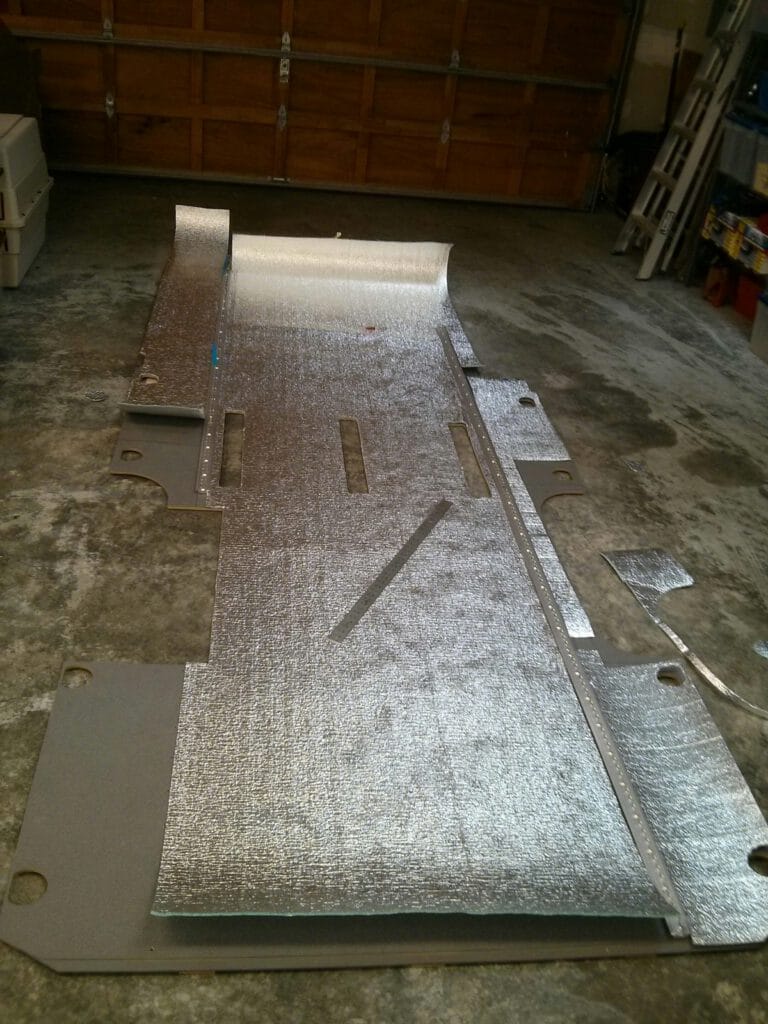 Tracing out the low-E foam on the wooden floor before we reinstalled it