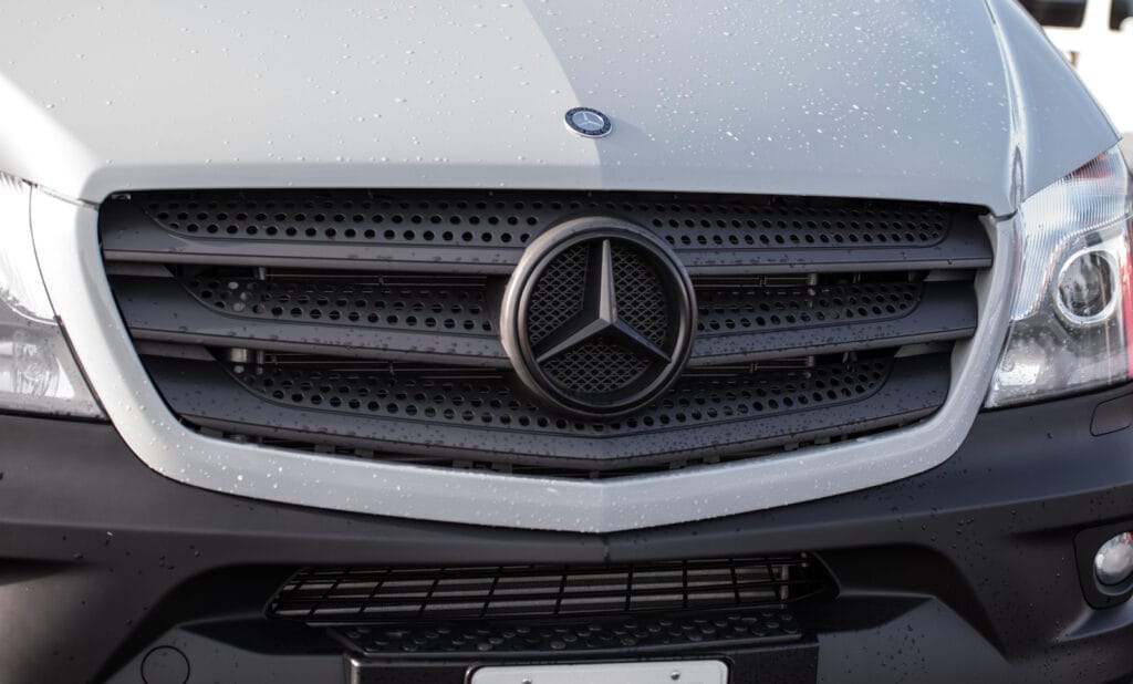 Mercedes logo on our van after plastidip. It blends in with the grille really well.