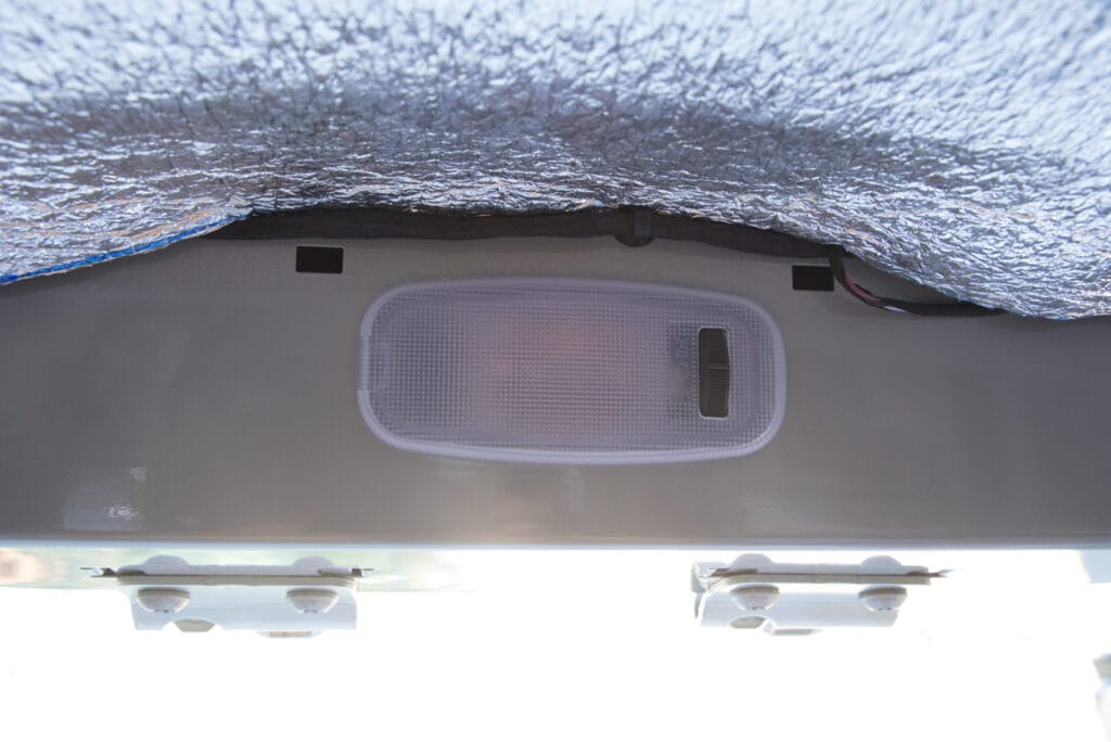 Courtesy light with switch above rear door