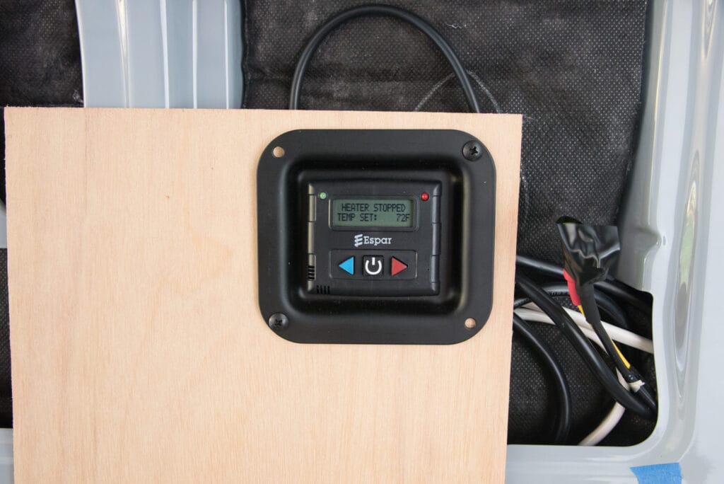 Thermostat in its temporary mounting on the wall