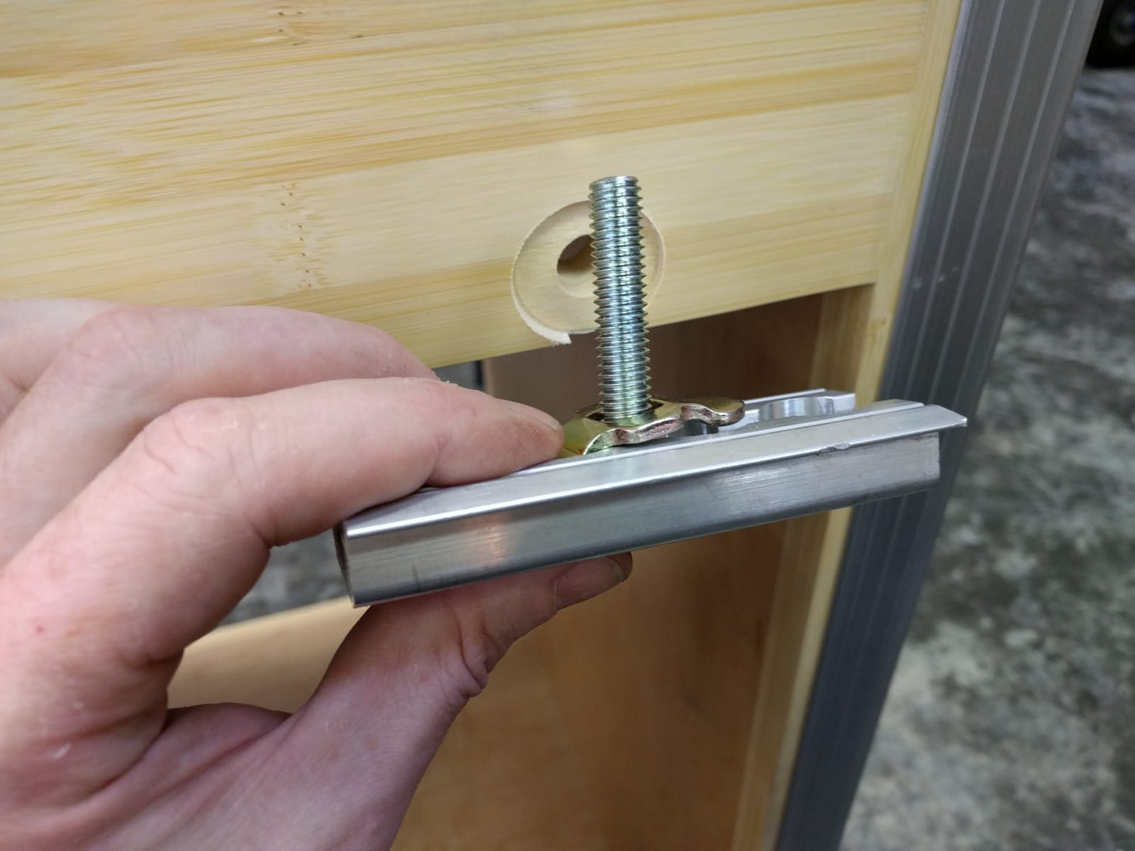 L-track bolt to cabinet