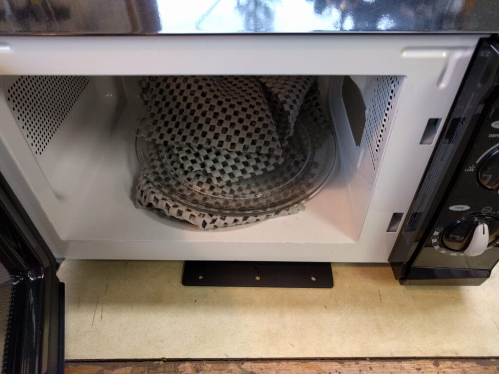 Microwave with attachment plate