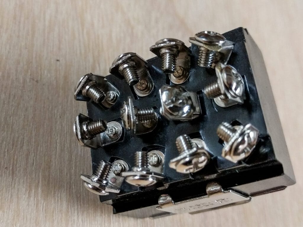 Dual-throw four-position switch for rear speakers