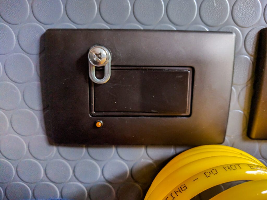 Heater switch with light and safety catch