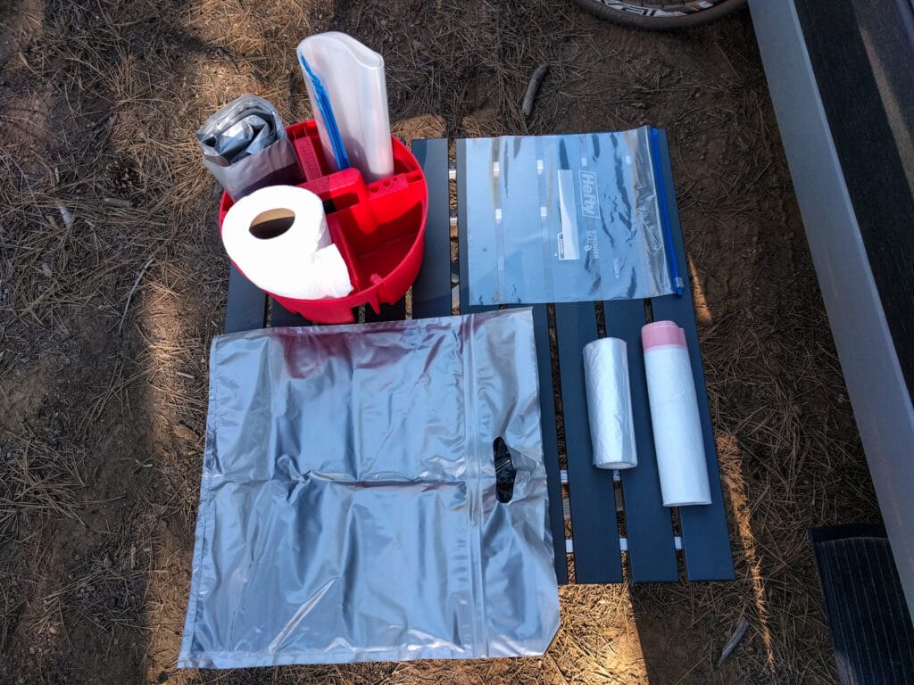 Poop bucket organizer and contents