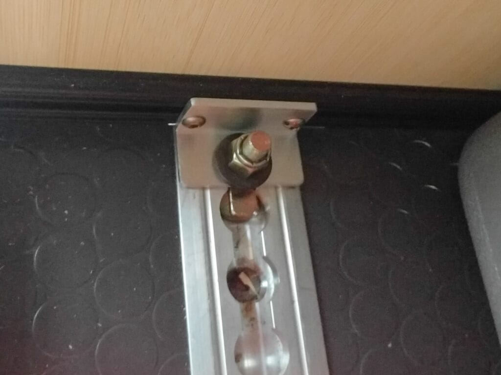 80/20 mounted to l-track with a piece of aluminum angle