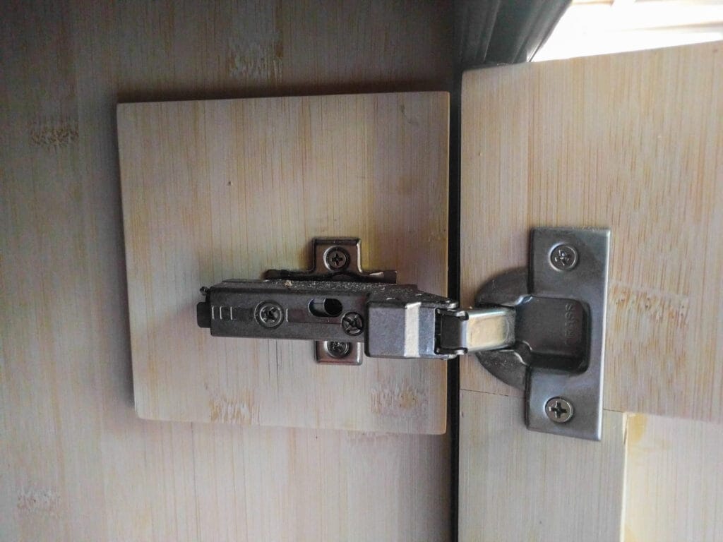 Close-up of door hinge mounting area with second layer of 1/4" ply to provide attachment point