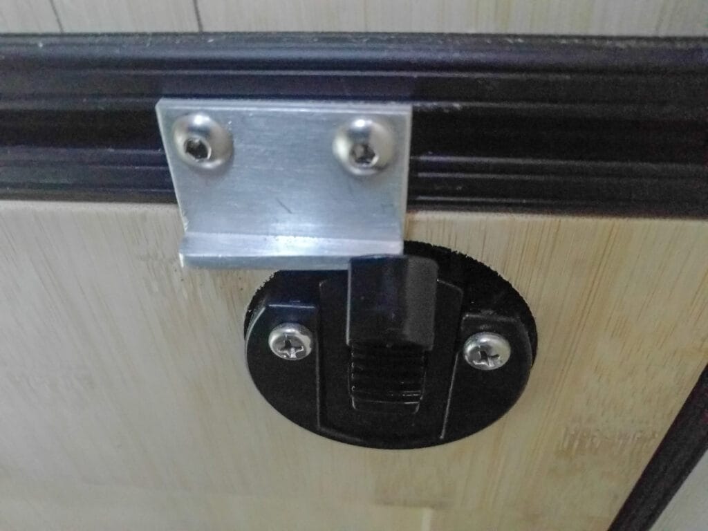 Door catch strike plate cut on an angle for adjustment (a little too thick right now though...)