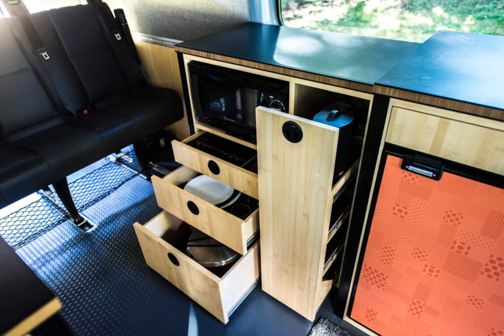 Microwave cabinet with storage below and "pantry" pull-out