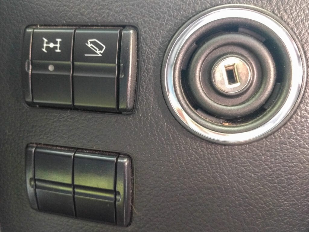 4x4 and low range buttons to the right of the steering wheel
