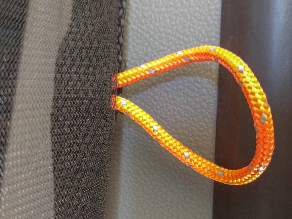 orange paracord loops on the mosquito netting