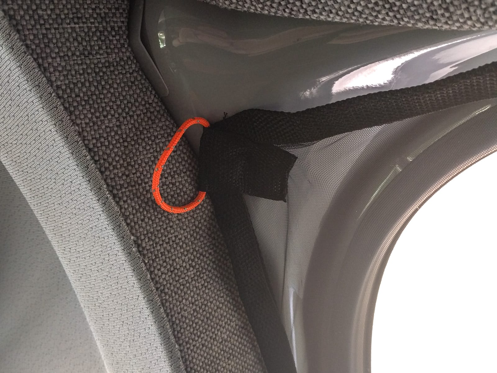 Mosquito net with paracord pull to unclip securing magnet