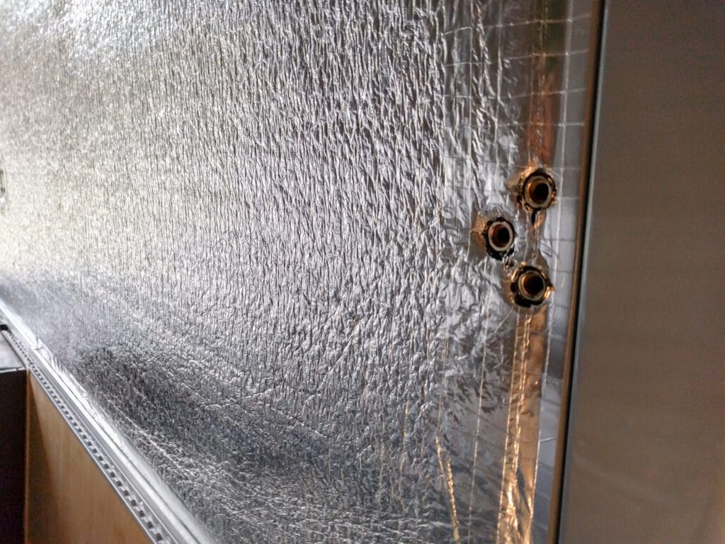 Holes for the bed rail drilled in the c pillar in a 170 van
