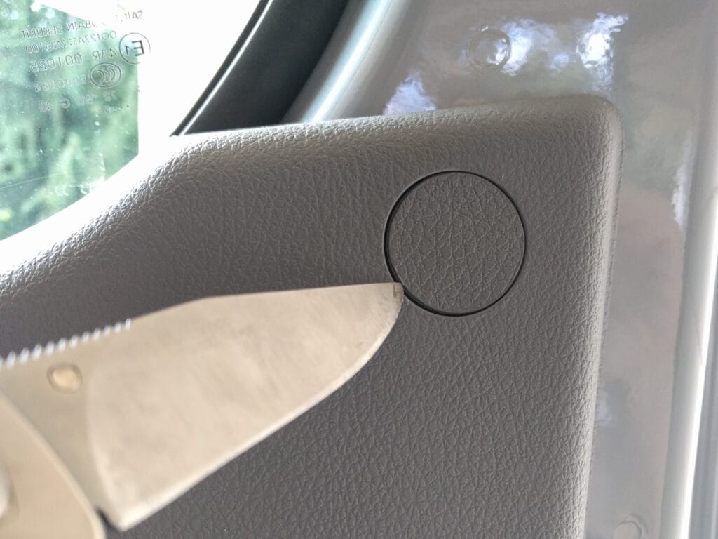 Door panel removal - top screw caps