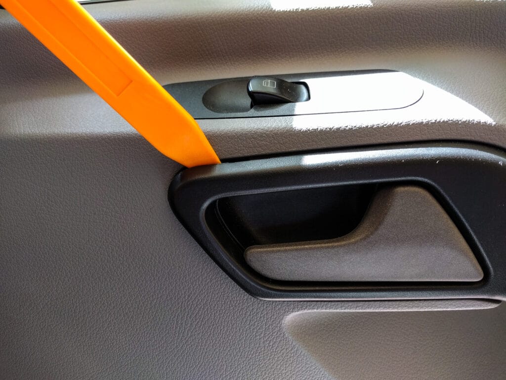 Door panel removal - handle surround