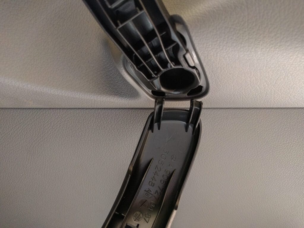 Door panel removal - handle surround unhooks at bottom end