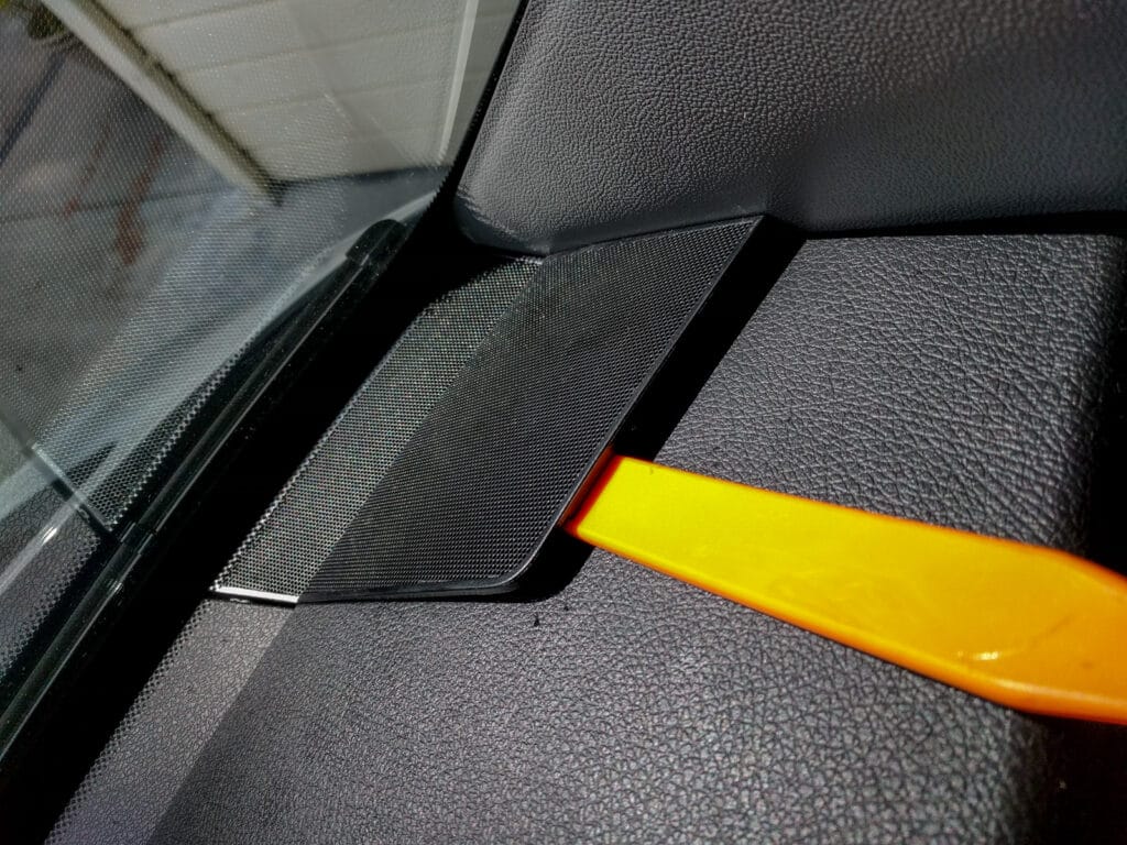 Remove the tweeter grille and then pull the A pillar cover off (start at the top, use the trim tool, and give it a tug)