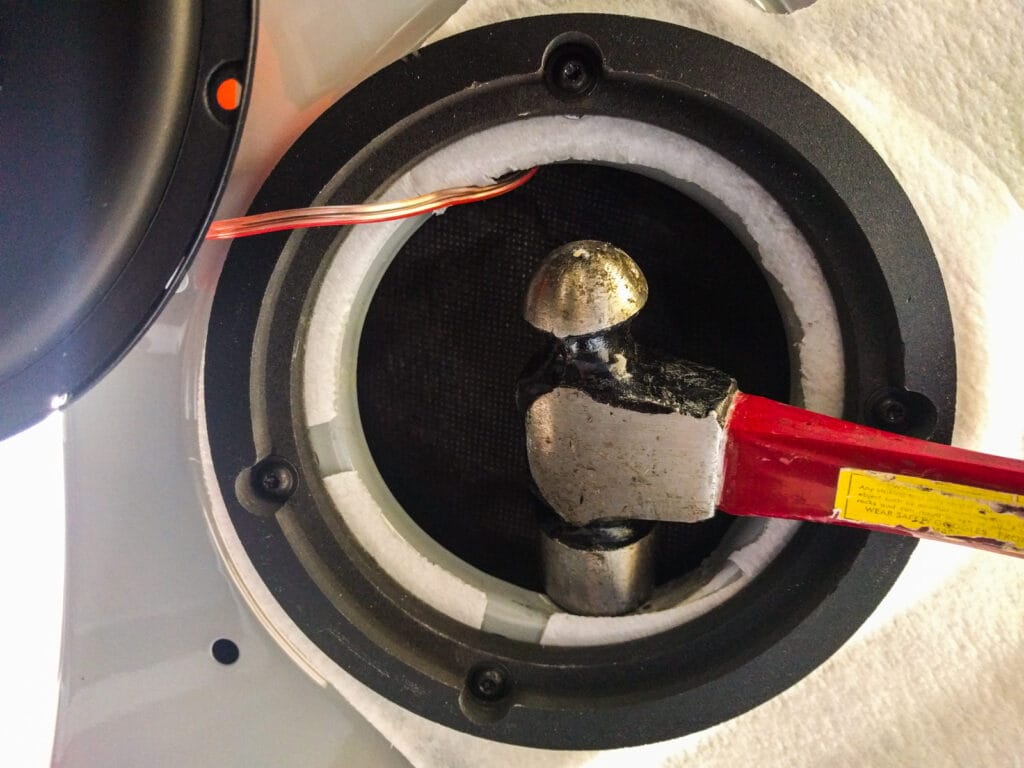 Attach the spacer ring to the speaker area. You might have to "relieve" the area where the cables attach. Note the high precision tool I'm using for that job. Spray the metal afterwards if you damaged the paint.