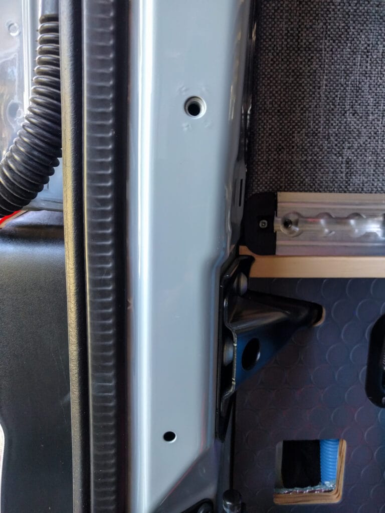 Holes we used for a grab handle in the D pillar by the rear doors