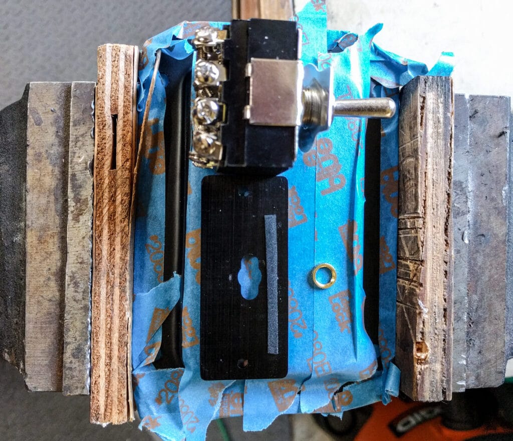 Penn Elcom plate laid out with components for spacing before drilling. Lots of blue tape to protect the paint.