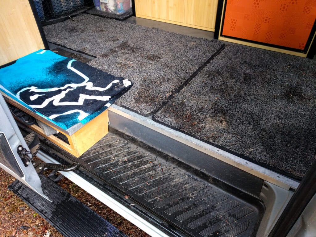 Absorbent floor mats catch mud, pine needles, water