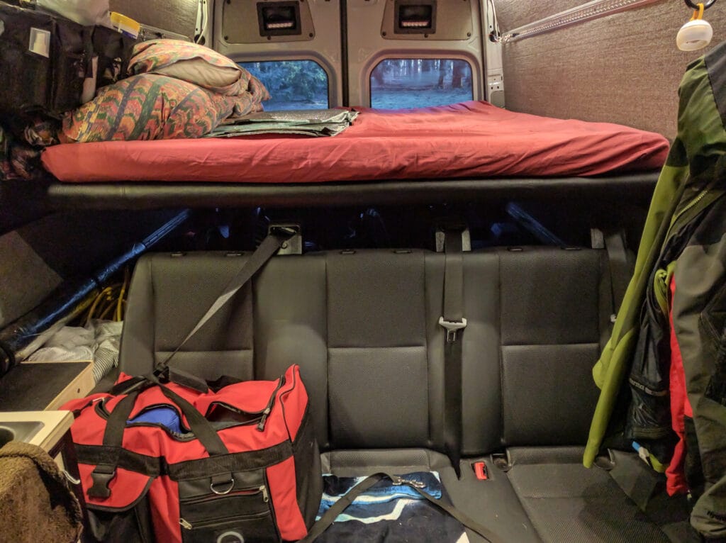 Bed in place with vinyl covered foam cushioning above bench seat