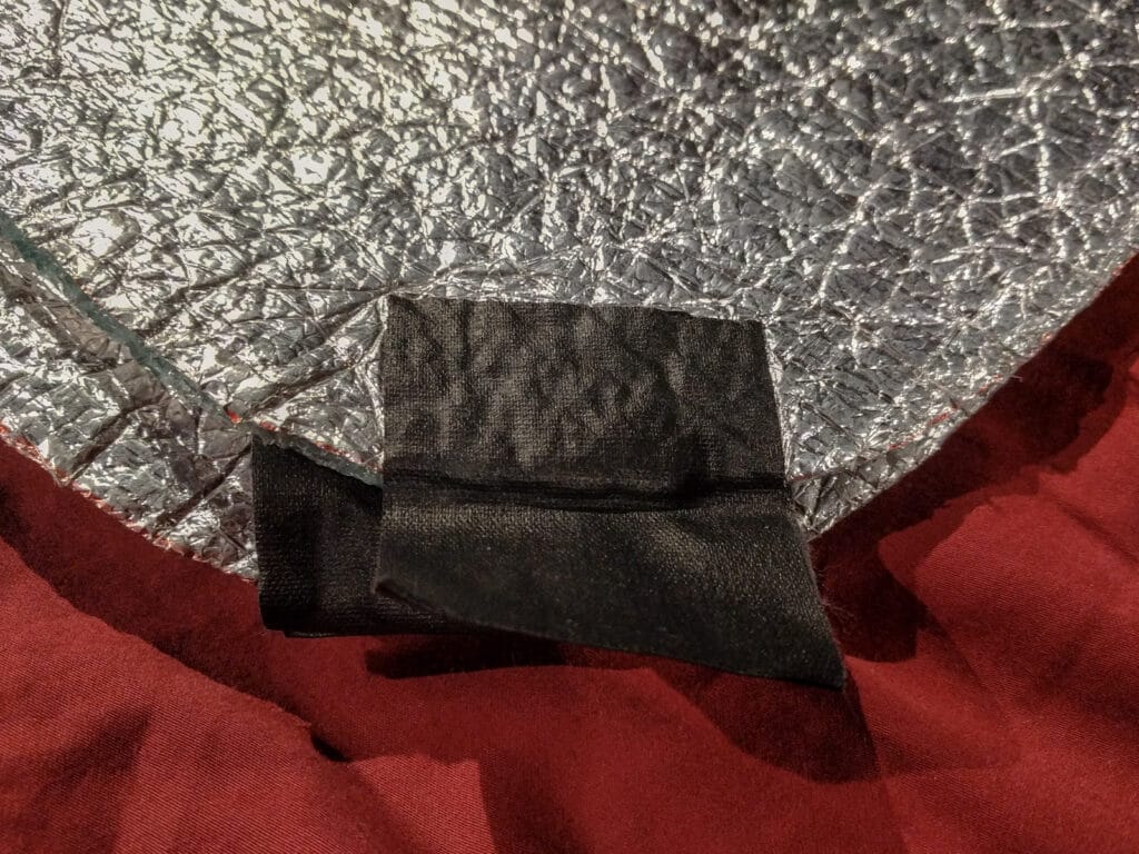 Here the gaffer tape is folded back on itself to form a pull tab on the edge of a window shade