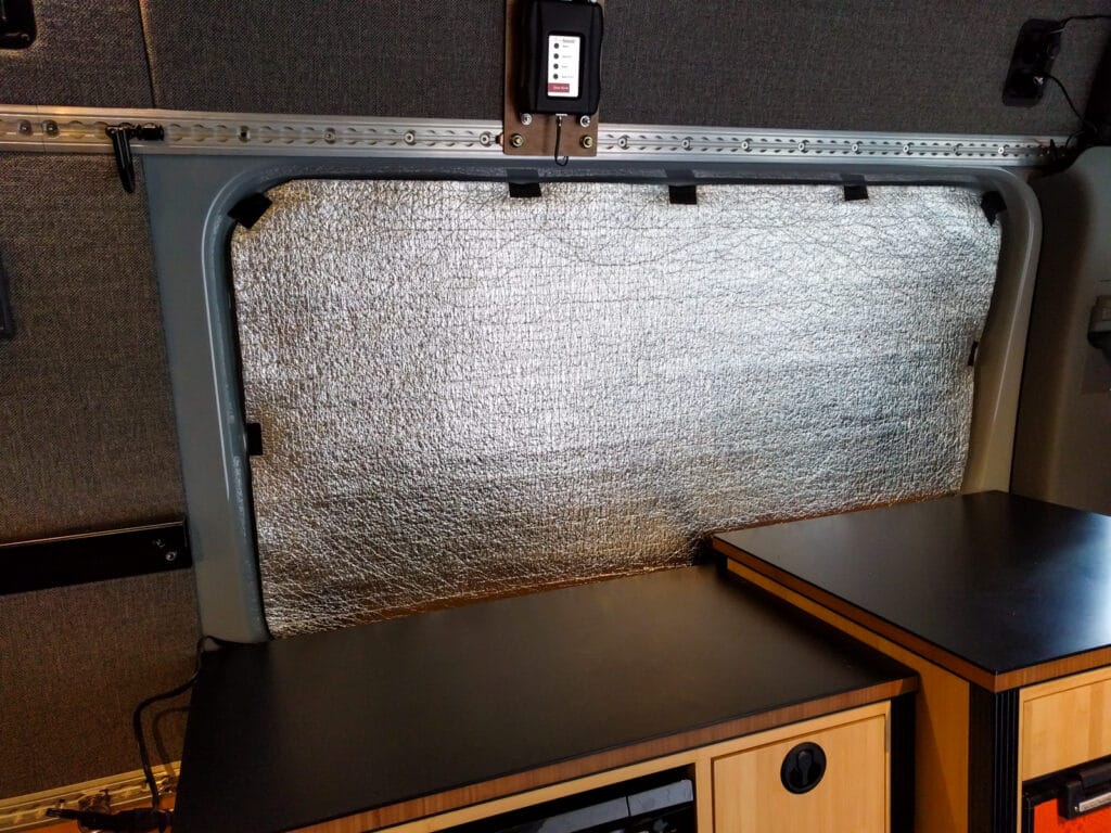 Low-E foil-faced foam window covers insulate and cut out the light