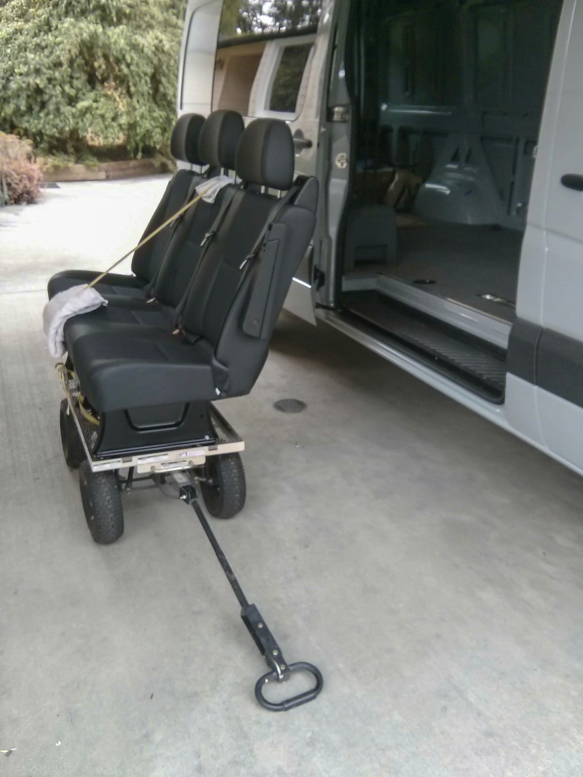 Three-person passenger bench seat removed from van