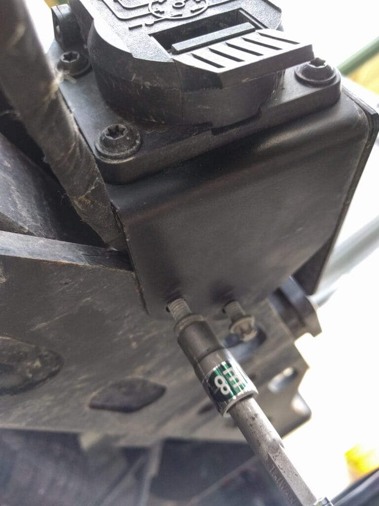The trailer wiring box is removable. Two E8 bolts underneath.