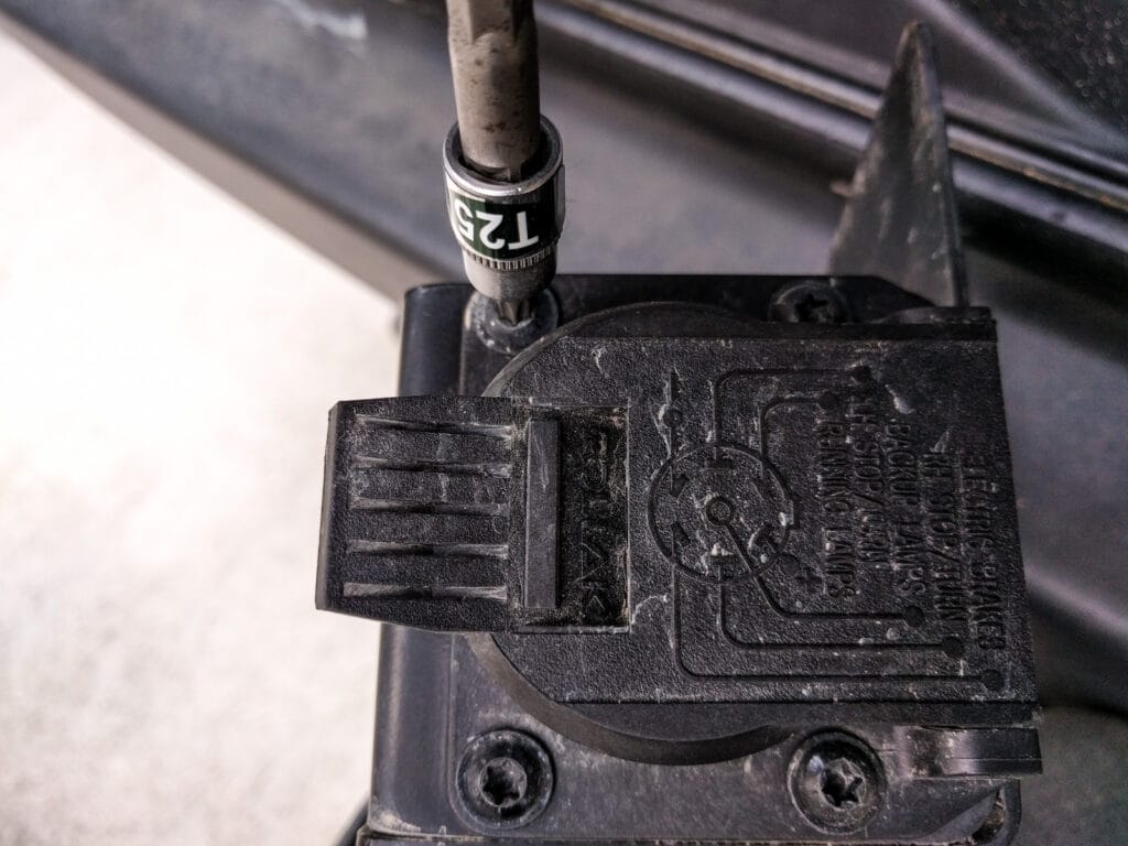 The trailer wiring connector can be removed from the metal housing - T25 bolts