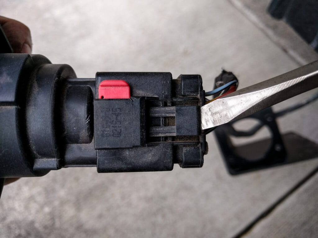 Now you can unclip the wires from the trailer connector