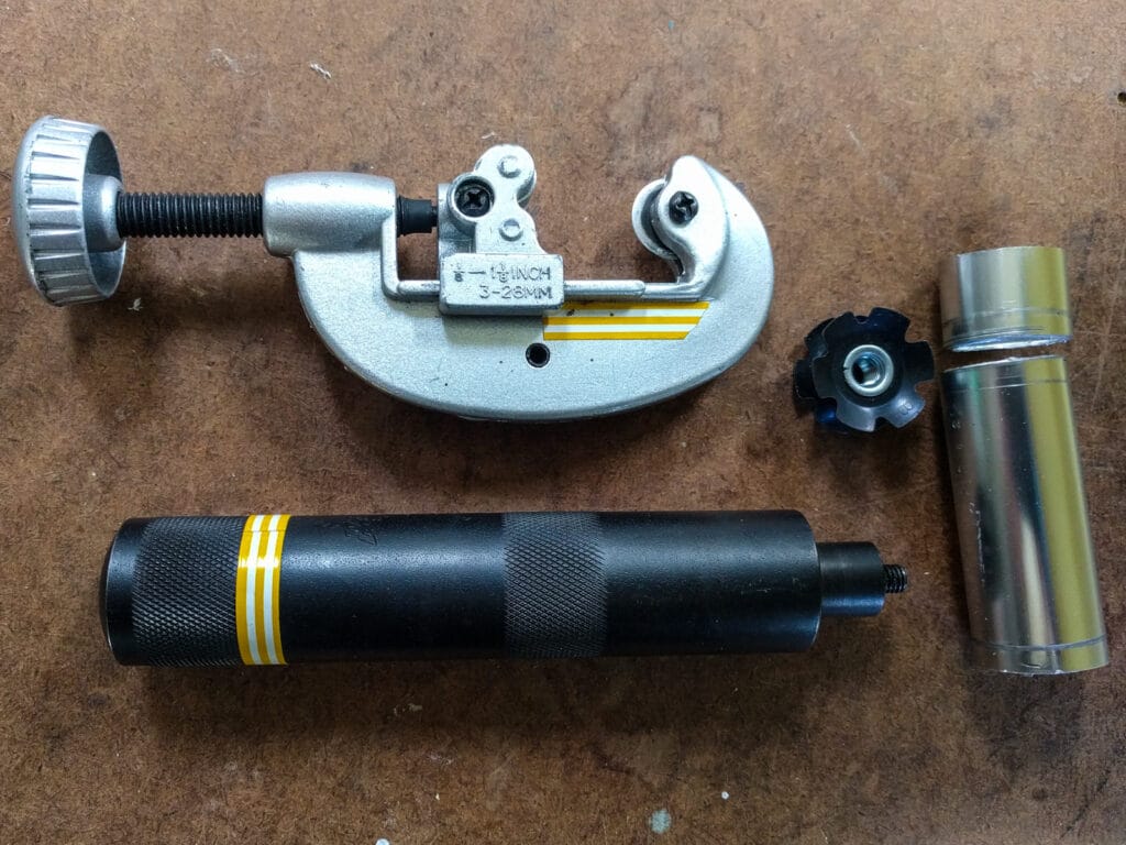 The parts needed to remove and reinstall the star nuts in the top end of the ladder legs
