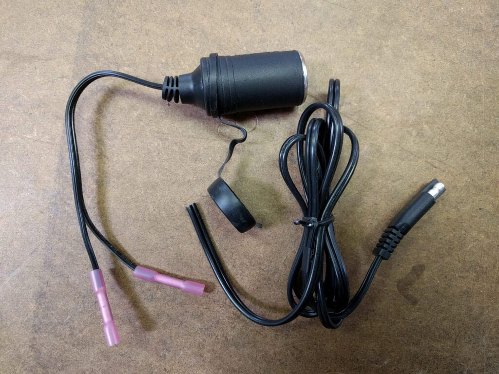 Cigarette lighter adaptor with cable connectors crimped on