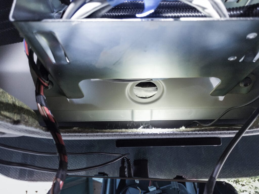 The metal bracket that supports any equipment you install in the cubby area