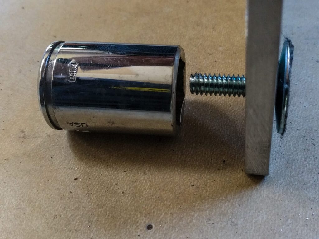 Using a socket to press elevator bolts into aluminum bar stock