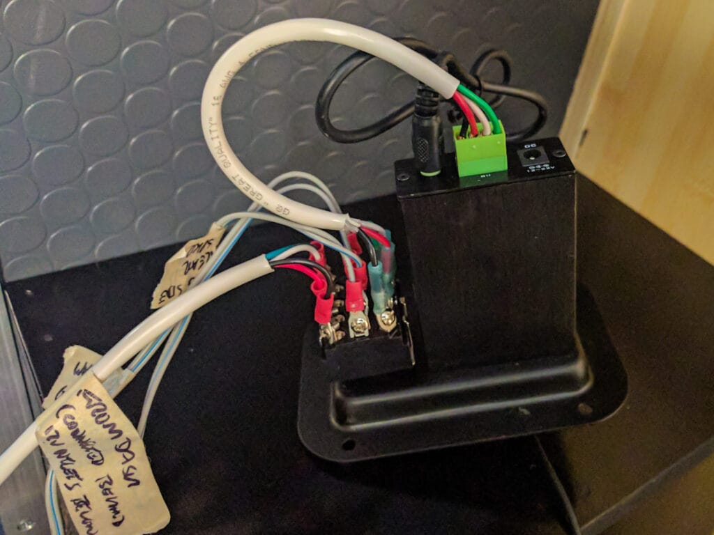 The back of the plate that holds the amp, speaker switch, and 3.5mm input jack.