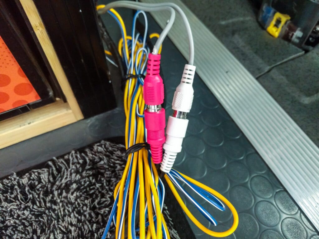 There are RGA connectors on the other end of the bullet terminals. You could run component level outputs to the sub if the head unit supported that