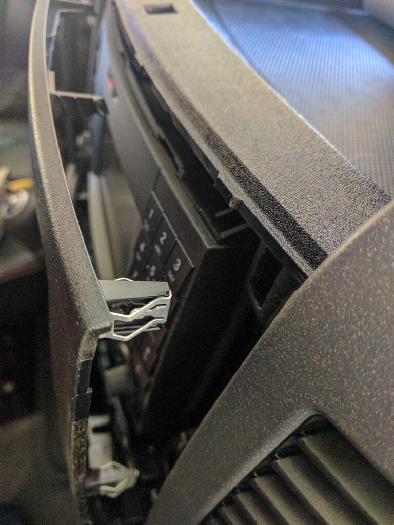Start by removing the central console panel. It has seven spring clips.