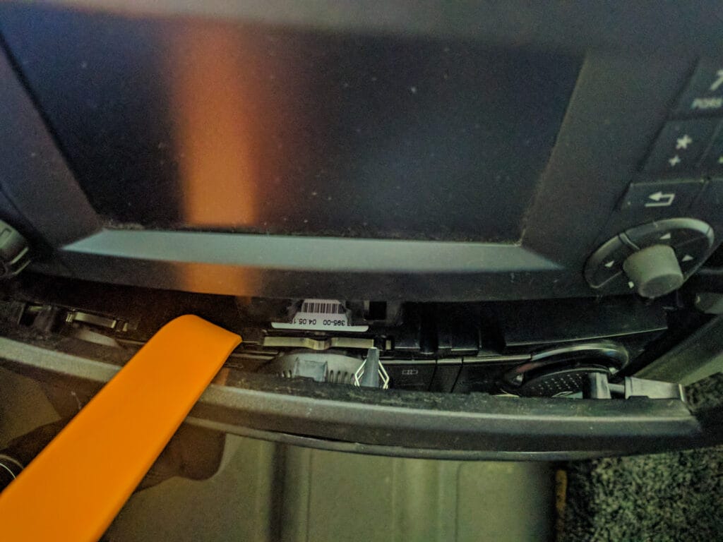 This is the seventh clip - in the middle of the panel just below the stereo.