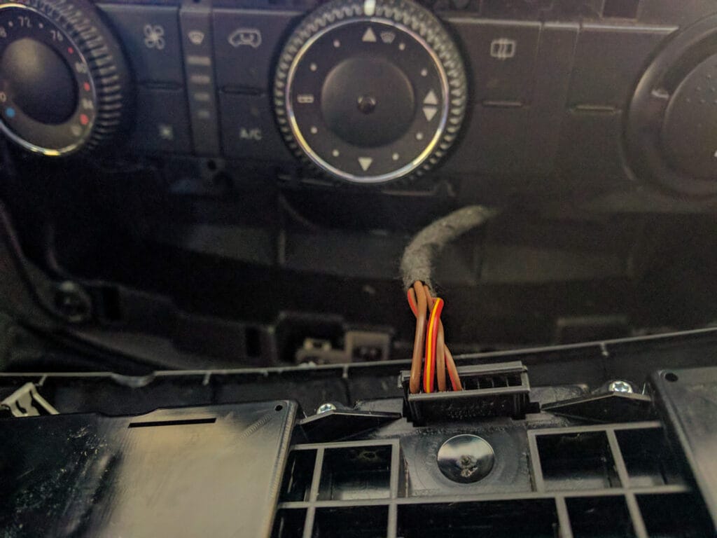 Once you have the panel unclipped, remove this wiring connector so that you can put the panel to one side.