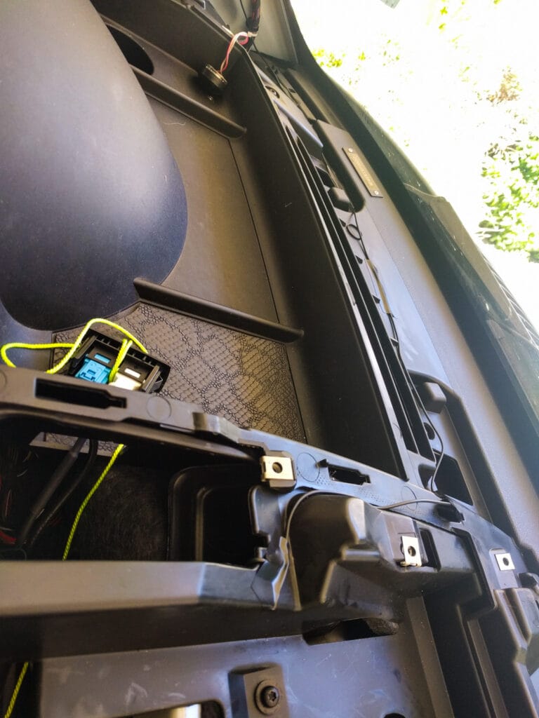 The microphone cable runs along the dash - we taped it down and then reinstalled the top piece of the dash.