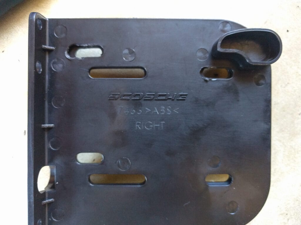 We needed to widen the screw slots in these brackets so that the stereo could sit further forward.