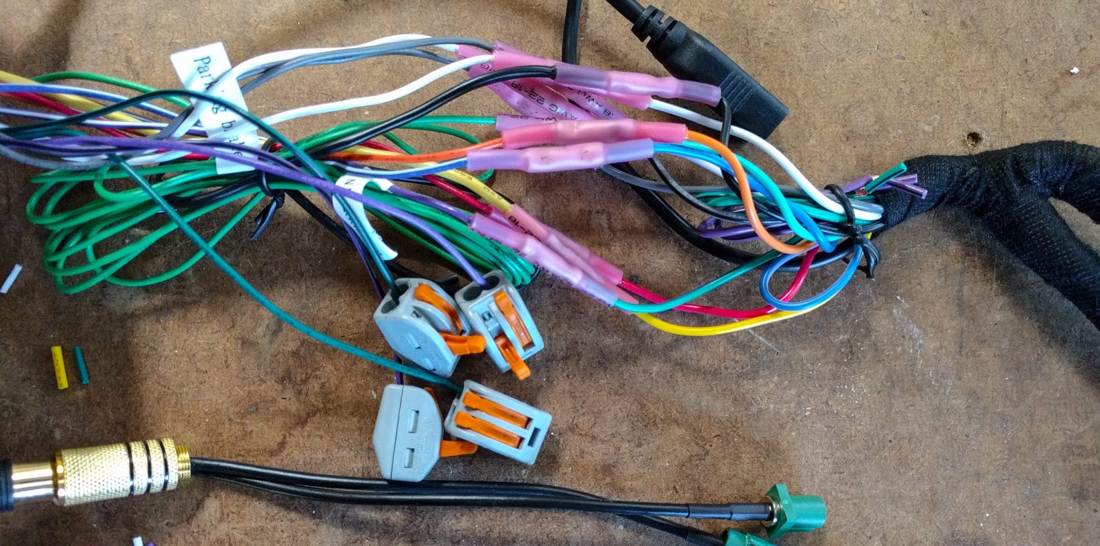 Aftermarket stereo cable wiring harness construction