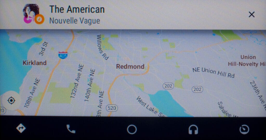 Google Maps (navigation) with a notification card when the music track changes