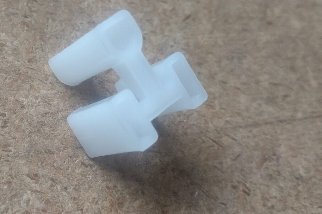 The plastic protectors that come attached to some consumer device power cables.
