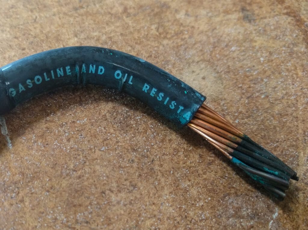 Black corrosion on copper cable from DEF exposure