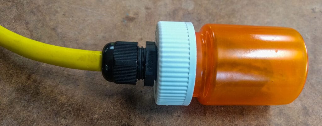 I mocked this up on the workbench to show the idea. We already threaded the cable through into the van, so we can't retrofit this solution.